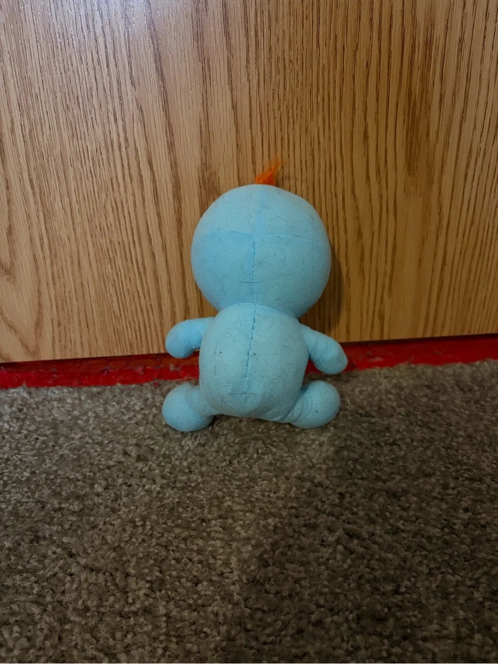 Blue Plush Character Toy with Orange Hair